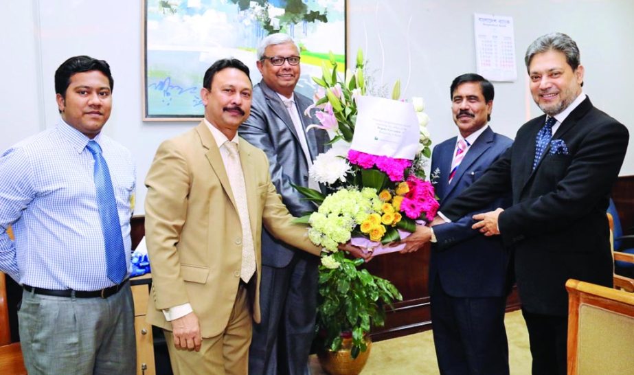 AFM Shariful Islam, Managing Director of National Bank Limited congratulated with floral bouquet to newly appointed Deputy Governor of Bangladesh Bank SM Moniruzzaman at his office in the city recently. Choudhury Moshtaq Ahmed, Additional Managing Directo