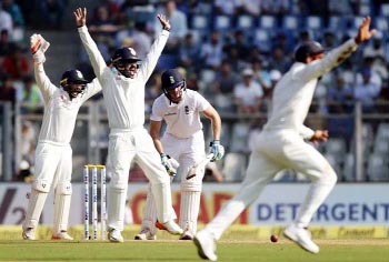 Indian players unsuccessful appeal for England's batsman Jos Buttler (second from right) on the second day of their fourth cricket Test match in Mumbai, India on Friday.