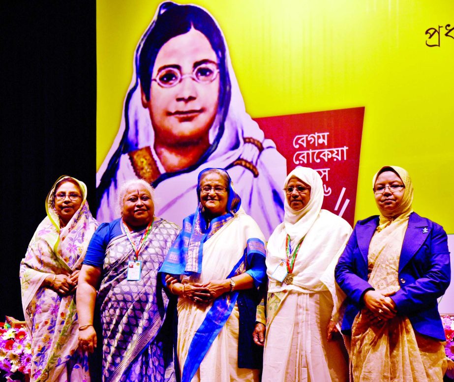 Prime Minister Sheikh Hasina poses with Aroma Dutta and Begum Nur Jahan after handing over Begum Rokeya Padak at Osmani Memorial Auditorium marking the Begum Rokeya Day on Friday.