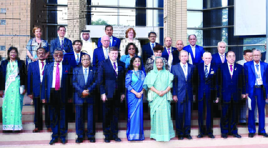Prime Minister Sheikh Hasina poses for photograph with the world leaders at the inaugural ceremony of Global Forum on Migration and Development-2016 at Bangabandhu International Conference Center in the city on Saturday. BSS photo