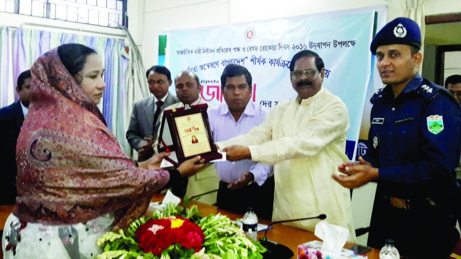 JOYPURHAT: Adv Shamsul Huq Dudu MP distributing crests among the winners of 'Joyeetas' at DC's conference room on the occasion of the Rokeya Day on Friday.