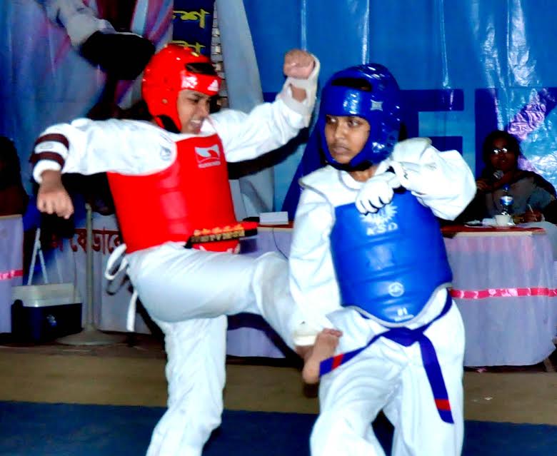 Action from the 14th National Senior-Junior Taekwondo Championship between Bangladesh Ansar and Bangladesh Navy at National Sports Council (NSC) gymnasium on Monday.