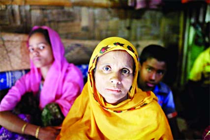 Rohingya Muslims women who have fled from violence in Myanmar take shelter at the Leda unregistered Rohingya camp in Teknaf, Bangladesh.