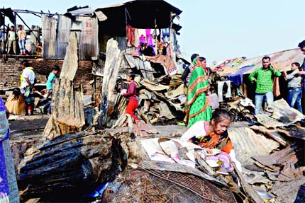 Over 100 shanties at Sattala slum in city's Mohakhali area were gutted in midnight fire on Sunday. About thousand people rendered homeless. This photo was taken on Monday morning.