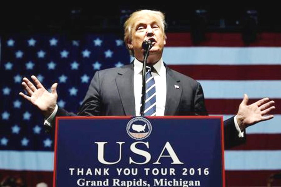 US President-elect Donald Trump speaks at a "Thank You USA" tour rally in Grand Rapids, Michigan, US on Monday.