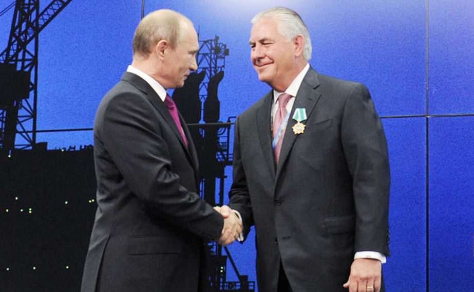 Russian President Vladimir Putin (L) with Trump's Secretary od state pick Rex W Tillerson.