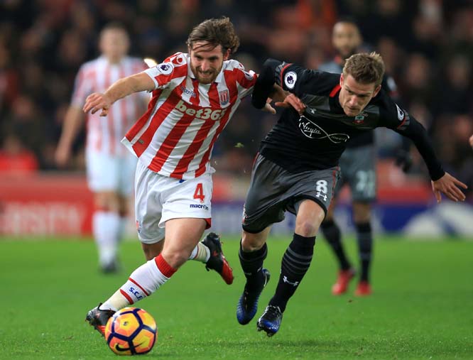 Stoke City's Joe Allen (left) controls the ball under pressure from Southampton's Steven Davis during their English Premier League soccer match at the Bet365 Stadium, Stoke on Wednesday.