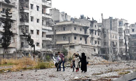 Syrian residents leave Aleppo's Bustan al-Qasr neighbourhood after pro-government forces captured the area in the eastern part of the war torn city.