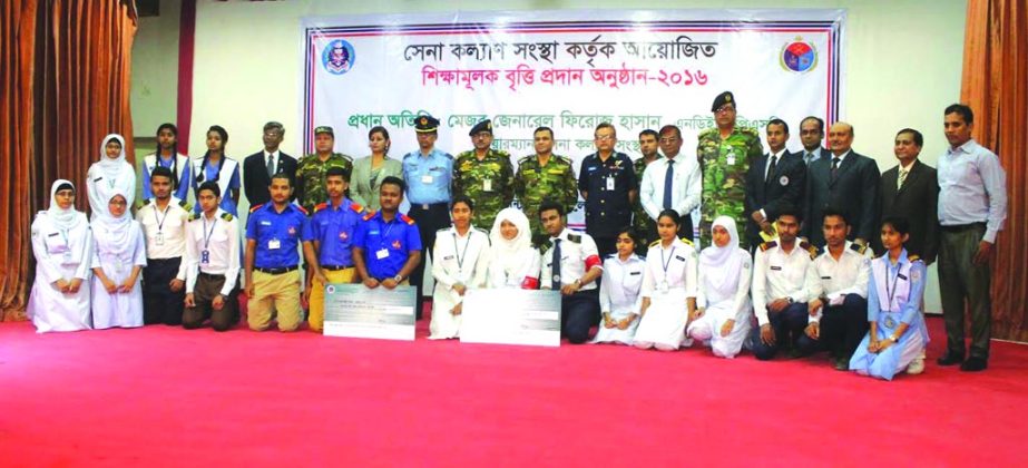 Major General Firoz Hasan, NDU, PSC, Chairman and Air Commodore SM Sahnewaz, BPP, NDC, PSC, DG of Welfare Division of Sena Kalyan Sangstha pose at an cheque distribution program of educational scholarship for its retired officers children at the Adazmi Ca