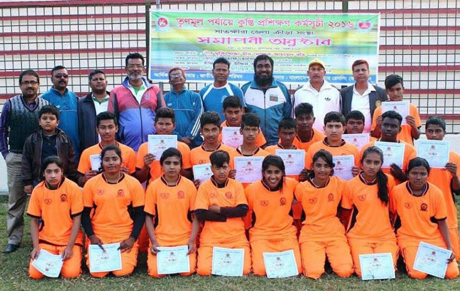 Participants of under-16 wrestling players' in Satkhira pose for photo with the official and guests at the Satkhira district stadium on Saturday.