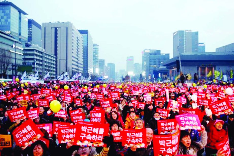 People join a protest rally demanding South Korean President Park Geun-hye's resignation in Seoul.