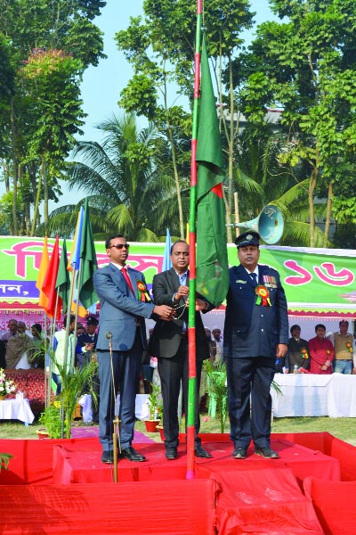 DAGHONBHUIYAN(Feni): Didarul Kabir Ratan, Chairman, Daghonbhuiyan Upazila Parishad, Saiful Islam Bhuiyan , UNO hoisting national flag at the Upazila Stadium in observance of Victory Day on Friday.