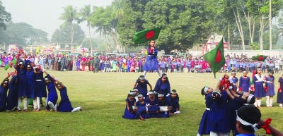 MADHUKHALI(Faridpur): Students of Gonderdiya Government Primary School performing at a display on the occasion of the Victory Day on Friday.