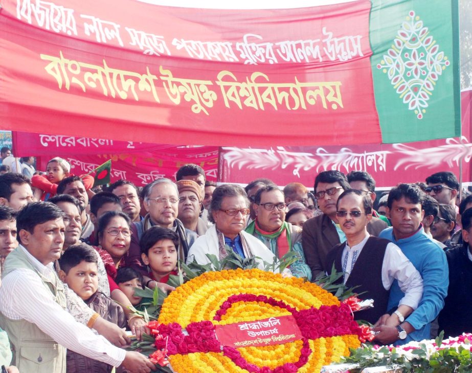 Vice-Chancellor Prof Dr MA Mannan, Pro-Vice Chancellor, Treasurer and the teachers, officers, employees of the Bangladesh Open University is placing a floral wreath to pay tributes to the freedom fighters at the National Martyrs Monument, Savar on the occ