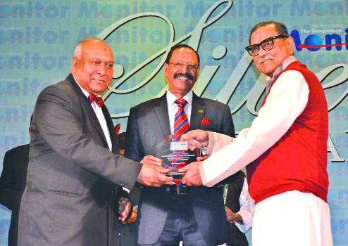 Civil Aviation and Tourism Minister Rashed Khan Menon MP, handing over a crest for long-standing services to the hospitality industry in Bangladesh to Shahid Hamid, Executive Director of Dhaka Regency Hotel and Chairman PATA Bangladesh Chapter in a city h