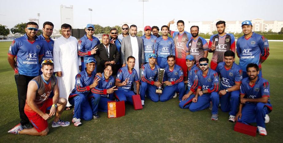 Afghanistan players and staff pose for a picture after their 44-run win against United Arab Emirates in 3rd T20I in Dubai on Sunday.