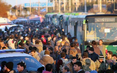 Evacuees from Aleppo arrive at the town of al-Rashideen, which is held by insurgents, Syria.