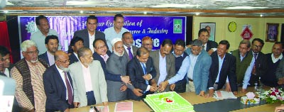 SYLHET: Leaders of Sylhet Chamber of Commerce and Industry cutting cake on the occasion of unveiling of logo at a function recently.