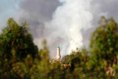 Smoke billows following an air-strike by the Saudi-led coalition targeting an arms depot in Sanaa.