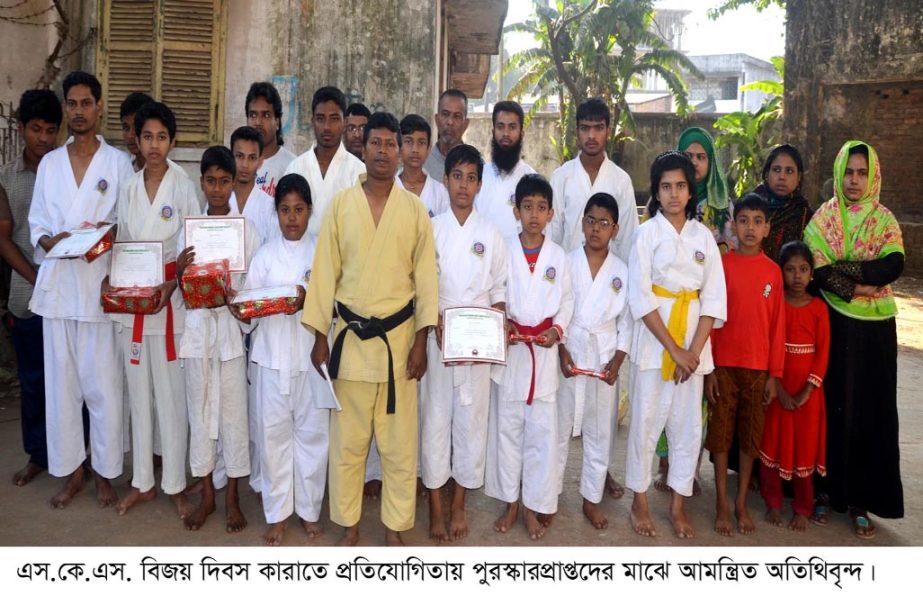 Winners of S K S Bijoy Dibas Karate Competition posed for photograph with guests in the Port City recently.