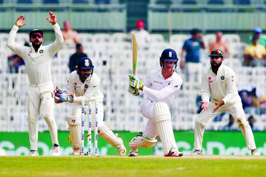India's wicket keeper Parthiv Patel (second left) attempts a wicket of England's Keaton Jennings (second right) during their fifth day of the fifth cricket Test match in Chennai, India on Tuesday.