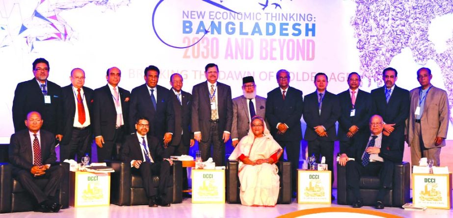 Prime Minister Shaikh Hasina poses with the leaders of Dhaka Chamber of Commerce and Industry (DCCI) at a city hotel on Wednesday after inaugurations of an international conference on â€˜New Economic Thinking: Bangladesh 2030 and Beyond.