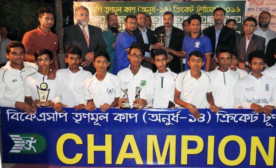 Players of Feni District Under-14 team, who became champion in BKSP Trinomul (Grassroot) Cup Cricket tournament pose for photo with the trophy and guests at the Women Sports Complex ground in Chittagong on Wednesday.