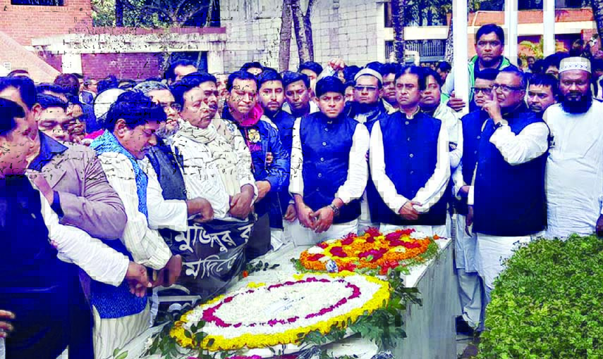 Leaders of Bangladesh Awami League, Dhaka South unit paying tributes to Father of the Nation Bangabandhu Sheikh Mujibur Rahman by placing wreaths at his mausoleum in Tungipara on Saturday.