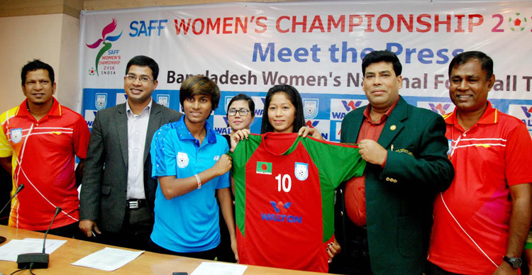 Head of Sports and Welfare Department of Walton Group FM Iqbal Bin Anwar Dawn (second from right) handing over the jersey to Captain of Bangladesh National Women's Football team Sabina Khatun (fifth from the right) at the conference room of Bangladesh Fo