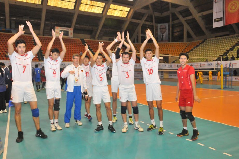 Members of Kyrgyzstan National Volleyball team celebrating after beating Maldives National Volleyball team in their match of the Bangabandhu Asian Senior Men's Central Zone International Volleyball Championship at the Shaheed Suhrawardy Indoor Stadium in