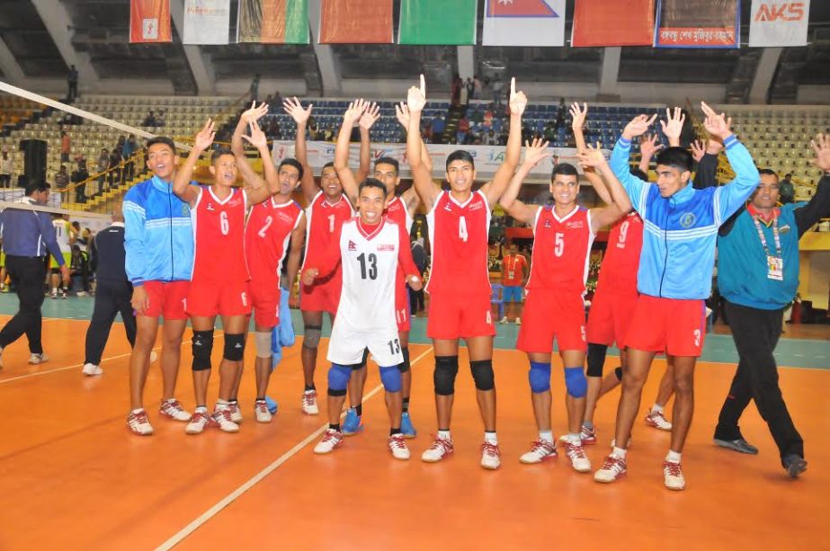 Members of Nepal National Volleyball team celebrating after beating Afghanistan team in their match of the Bangabandhu Asian Senior Men's Central Zone International Volleyball Championship at the Shaheed Suhrawardy Indoor Stadium in Mirpur on Saturday.