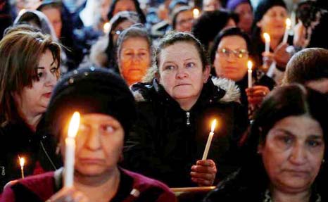 Iraqi Christians attend a mass on Christmas eve in the town of Bartella, east of Mosul.
