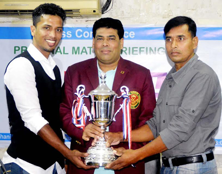 Captain of Bangladesh Navy Russell Mahmud Jimmy (left) and Captain of Bangladesh ArmyAbu Salam (right) and Head of Sports and Welfare Department of Walton Group FM Iqbal Bin Anwar Dawn pose with the trophy of the Marcel Victory Day Hockey Competition at t