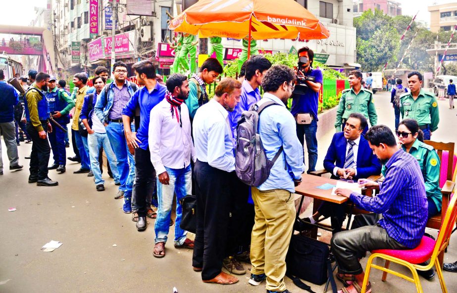 Mobile court on Monday fined people for crossing city's Banani-Kakoli Square avoiding foot over-bridge violating traffic rules. This photo was taken on Monday.