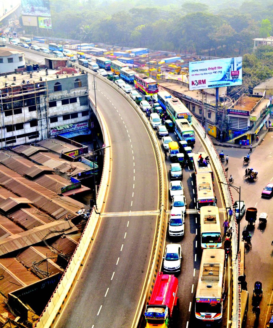 Commuters' suffering continues in the city as they experienced terrible traffic chaos even on the flyover constructed to ease the movement. This photo shows Mayor Hanif Flyover near Tikatuli being congested with serious gridlock on Monday.