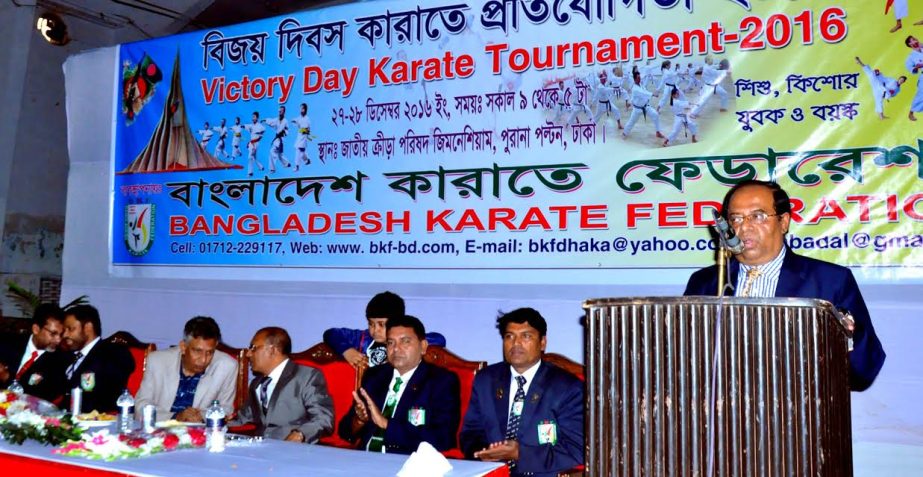 The winners of the Victory Day Karate Competition with the guests and officials of Bangladesh Karate Federation pose for a photo session at the gymnasium of National Sports Council on Tuesday.