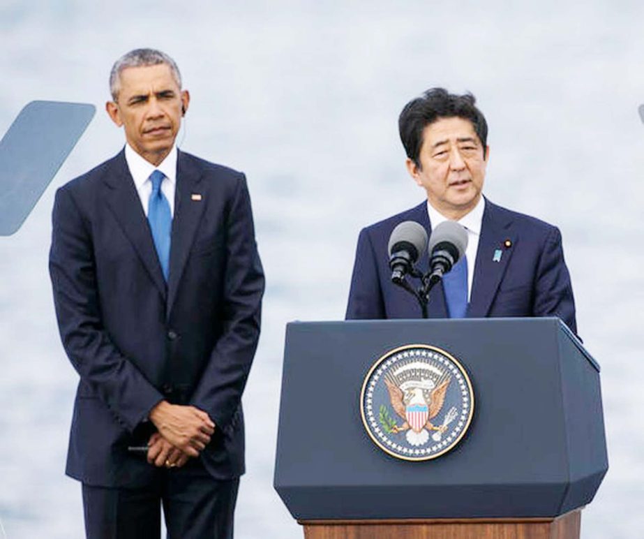 Japanese Prime Minister Shinzo Abe, right, with U.S. President Barack Obama, speaks at Joint Base Pearl Harbor Hickam on Tuesday, in Honolulu.