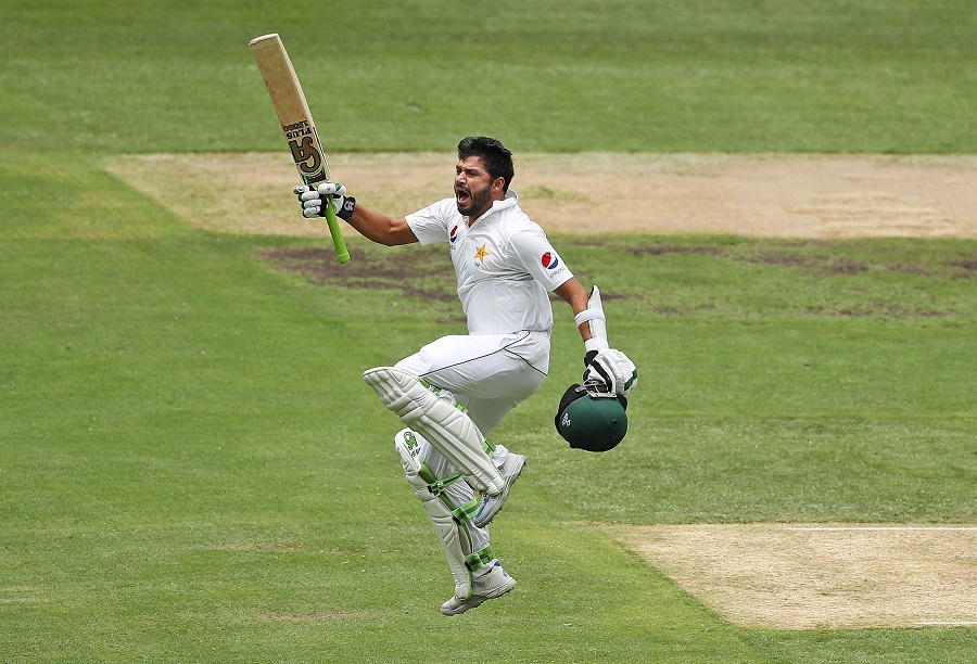 Azhar Ali of Pakistan leaps in the air as he celebrates reaching 200 runs during day three of the Second Test match between Australia and Pakistan at Melbourne Cricket Ground in Melbourne, Australia on Wednesday.