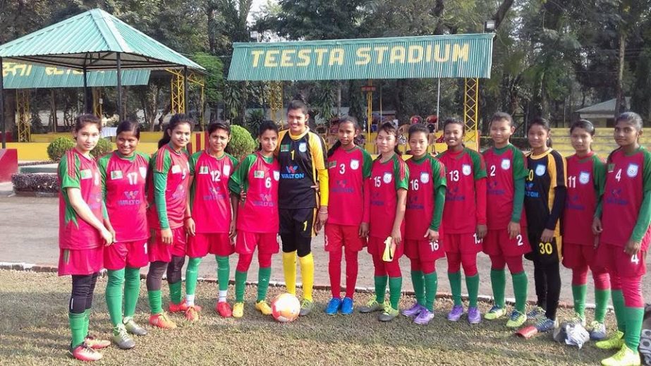 Players of Bangladesh Women's Football team pose for photo during a practice session in India on Wednesday.