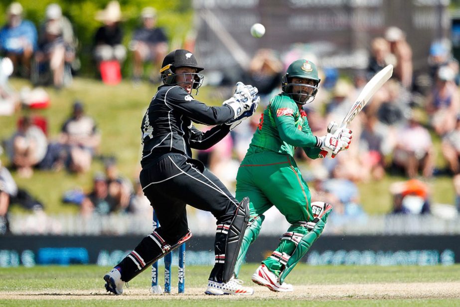 Imrul Kayes of Bangladesh bats as wicketkeeper Luke Ronchi of New Zealand looks on during the second One Day International match between New Zealand and Bangladesh at Saxton Field in Nelson, New Zealand on Thursday.