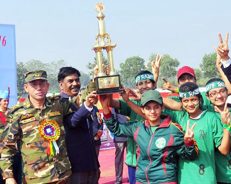 Adjutant General of Bangladesh Army Major General SM Motiur Rahman handing over the championship trophy to Razia House, which emerged as the champions of the Inter-House Annual Sports Competition of Joypurhat Girls' Cadet College at the college ground on