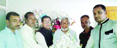 KULAURA(M'bazar): Newly -elected Zilla Parishad Chairman eminent freedom fighter Azizur Rahman being greeted by social worker Selim Ahmed, a newly-elected member of the Parishad recently. UP Member Nazrul Islam Hira , Saju Ahmed , Monir Uddin and Jashim
