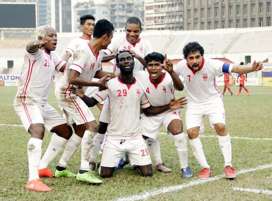 Players of Feni Soccer Club celebrating after scoring a goal against Bangladesh Muktijoddha Sangsad Krira Chakra during their match of the JB Bangladesh Premier League Football at the Bangabandhu National Stadium on Saturday.