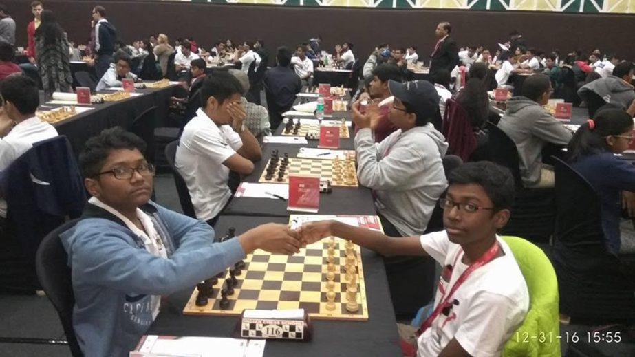 . FM Mohammad Fahad Rahman (left) of Access Chess Club shaking hands with his opponent Polakhare Aryan of India during their 6th round match of the IIFL 2nd Mumbai Junior International Chess Tournament at Mumbai in India on Saturday.