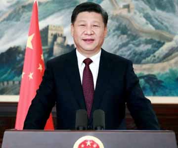 Chinese President Xi Jinping speaks during a New Year greetings broadcasted in Beijing.