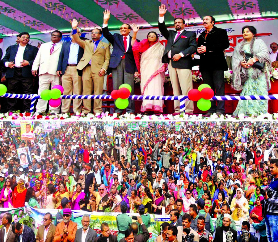 Jatiya Party Chairman Hussain Muhammad Ershad along with party colleagues waving hands at a grand rally organised on the occasion of the party's 31st founding anniversary in the city's Suhrawardy Udyan on Sunday.