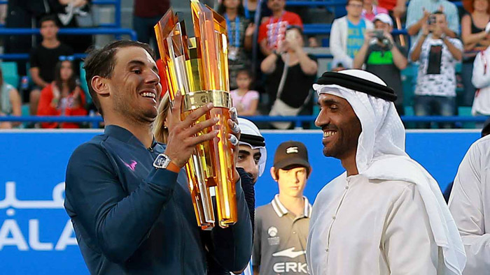 Spain's Rafael Nadal receives his trophy from Sheikh Nahyan bin Zayed al-Nahyan, Chairman of Abu Dhabi Sports Council, after defeating Belgium's David Goffin in the final match of the Mubadala World Tennis Championship 2016 in Abu Dhabi on Saturday.