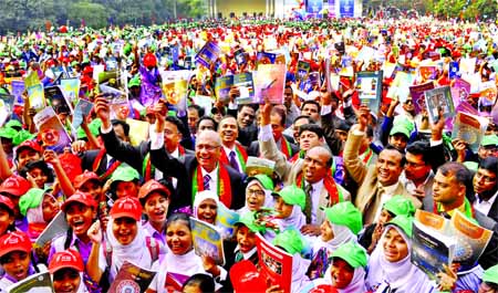 Students and teachers including guardians are celebrating National Textbook Festival-2017 on the first day of the New Year. Education Minister Nurul Islam Nahid is seen at the inaugural festival at Azimpur Govt Girls' High School and College campus on Su