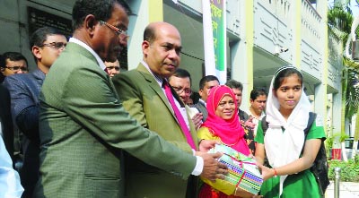 KISHOREGANJ: Md Azimuddin Biswas, DC, Kishoreganj distributing textbooks among the students of SV Government Girls' School on Sunday.