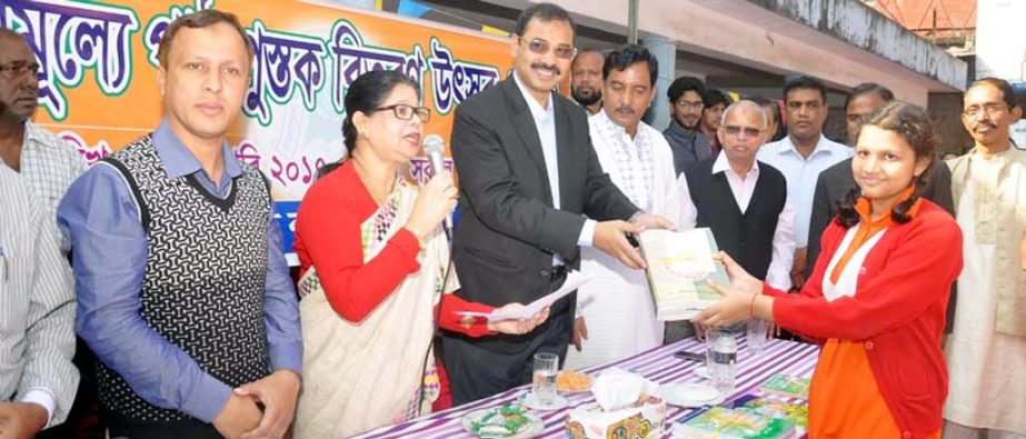 CCC Mayor A J M Nasir Uddin distributing textbooks on the occasion of the Natioanl Textbook Festival at Bangladesh Mahila Samity School premises on Saturday.